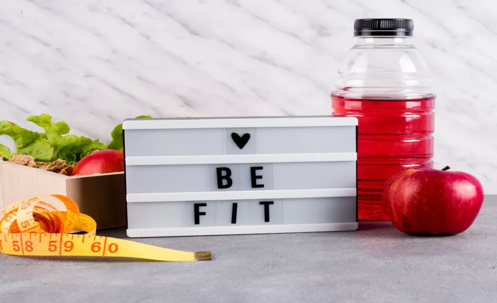 love be fit inscription board with healthy food